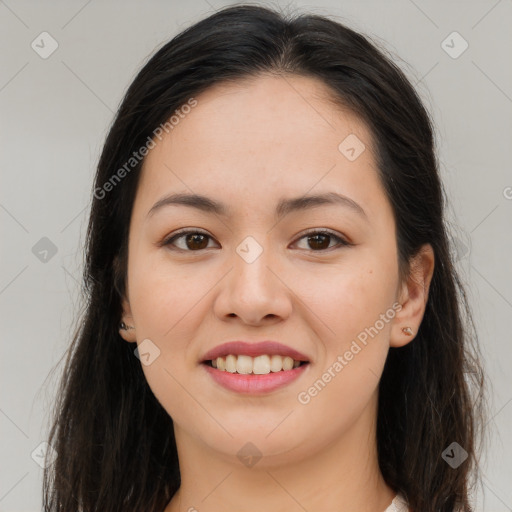 Joyful asian young-adult female with long  brown hair and brown eyes