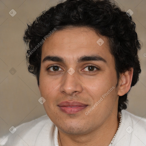 Joyful latino young-adult male with short  brown hair and brown eyes