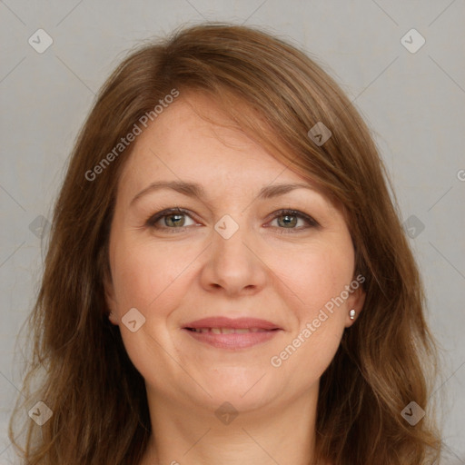 Joyful white adult female with long  brown hair and brown eyes