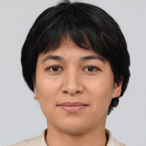 Joyful asian young-adult female with short  brown hair and brown eyes