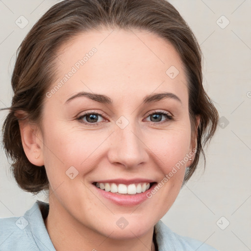 Joyful white young-adult female with medium  brown hair and blue eyes