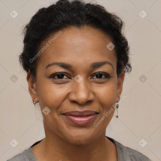 Joyful black adult female with short  brown hair and brown eyes