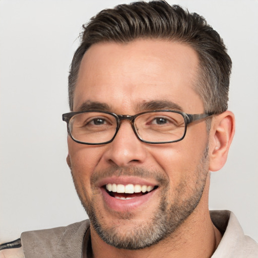 Joyful white adult male with short  brown hair and brown eyes