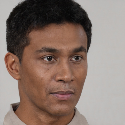Neutral black young-adult male with short  brown hair and brown eyes