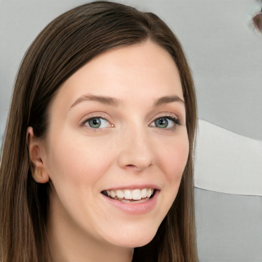 Joyful white young-adult female with long  brown hair and blue eyes