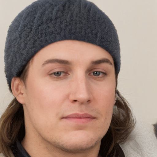 Neutral white young-adult male with short  brown hair and blue eyes