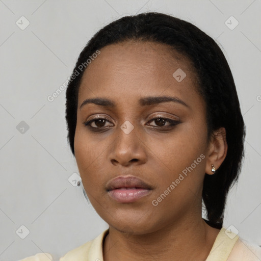 Neutral black young-adult female with short  black hair and brown eyes