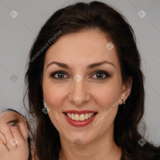 Joyful white adult female with long  brown hair and brown eyes