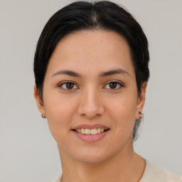 Joyful asian young-adult female with short  black hair and brown eyes