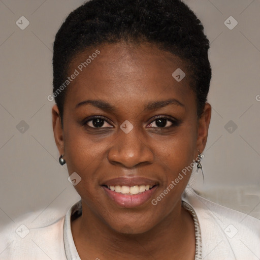 Joyful black young-adult female with short  brown hair and brown eyes