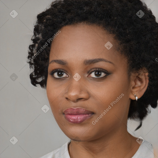 Joyful black young-adult female with medium  black hair and brown eyes