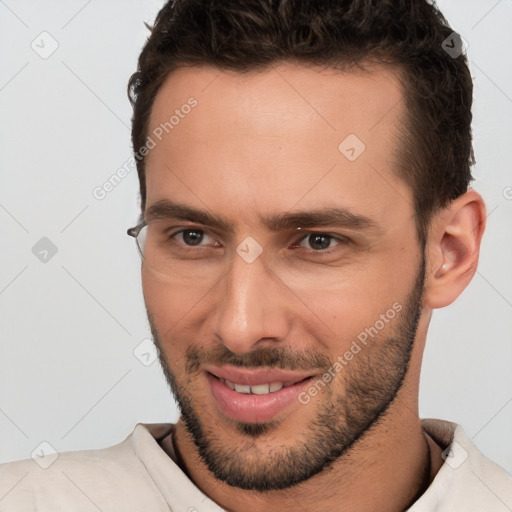 Joyful white young-adult male with short  brown hair and brown eyes