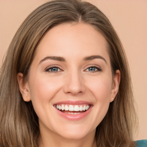 Joyful white young-adult female with long  brown hair and grey eyes