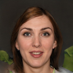 Joyful white young-adult female with medium  brown hair and green eyes