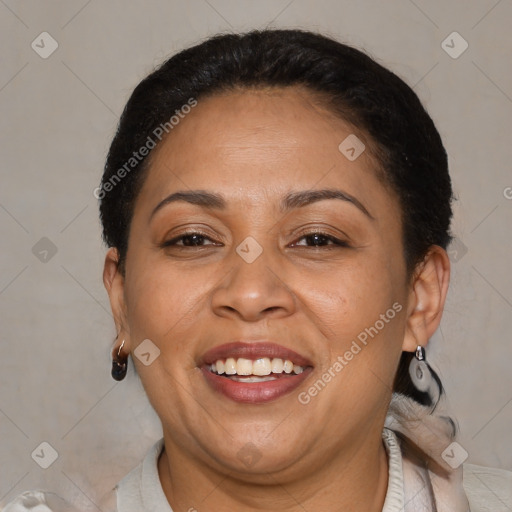 Joyful latino adult female with short  brown hair and brown eyes