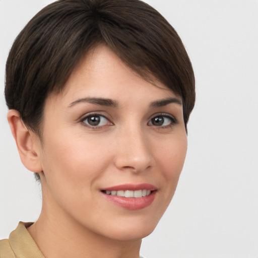 Joyful white young-adult female with short  brown hair and brown eyes