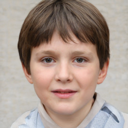 Joyful white child male with short  brown hair and grey eyes