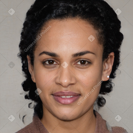 Joyful black young-adult female with medium  brown hair and brown eyes