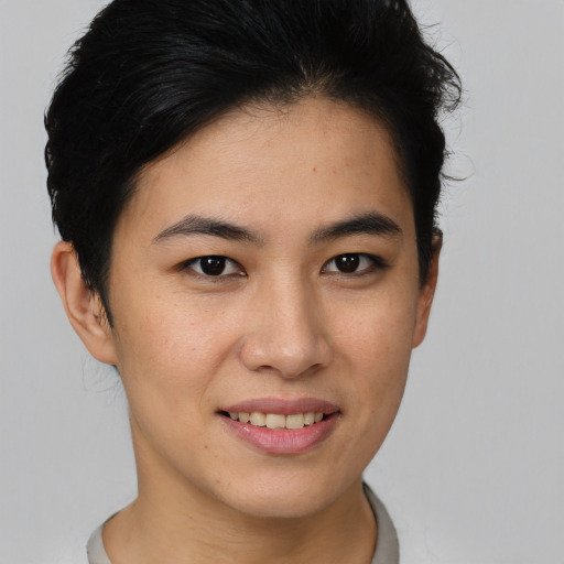 Joyful asian young-adult female with short  brown hair and brown eyes