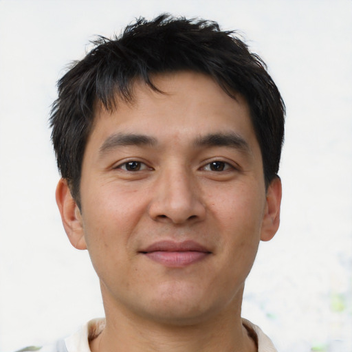 Joyful asian young-adult male with short  brown hair and brown eyes