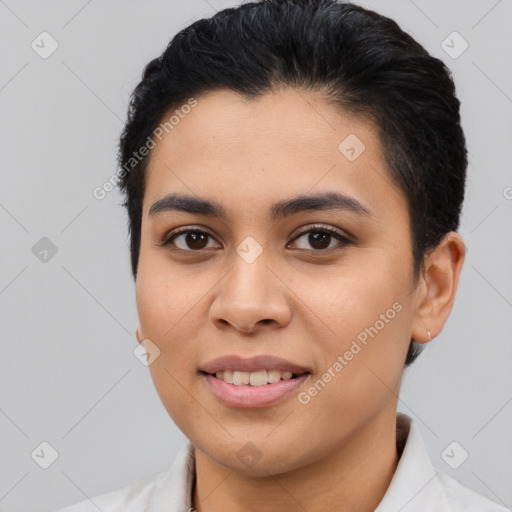 Joyful latino young-adult female with short  black hair and brown eyes