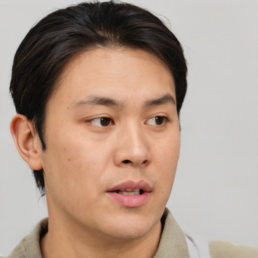 Neutral asian young-adult male with short  brown hair and brown eyes