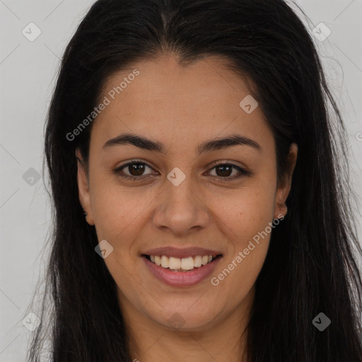 Joyful latino young-adult female with long  brown hair and brown eyes