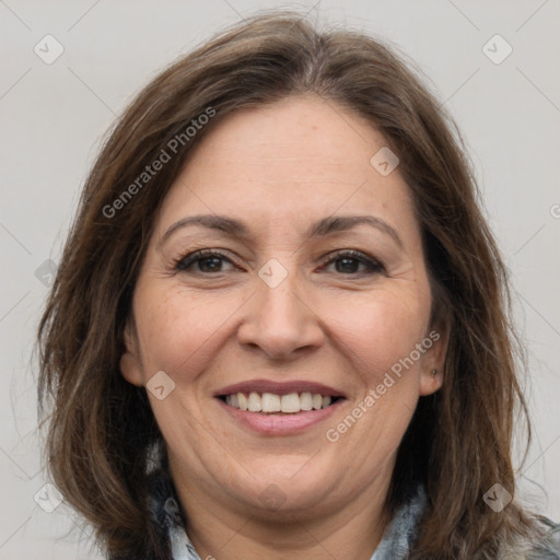 Joyful white adult female with long  brown hair and brown eyes