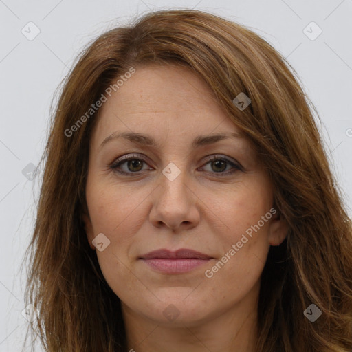 Joyful white adult female with long  brown hair and brown eyes