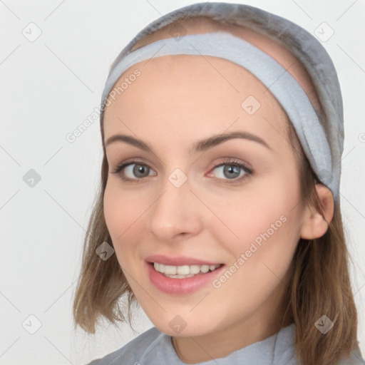 Joyful white young-adult female with medium  brown hair and blue eyes