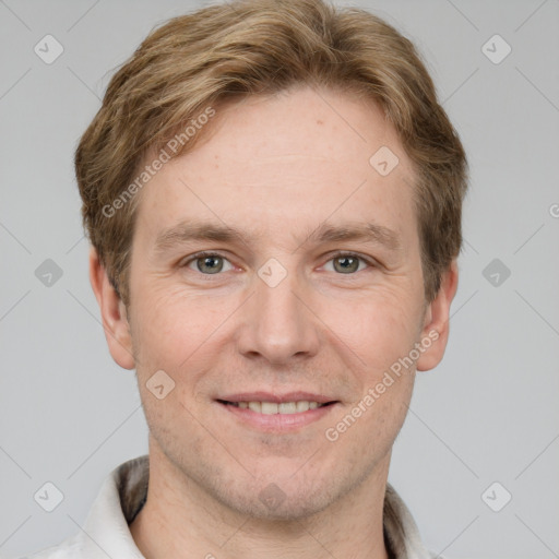 Joyful white adult male with short  brown hair and grey eyes