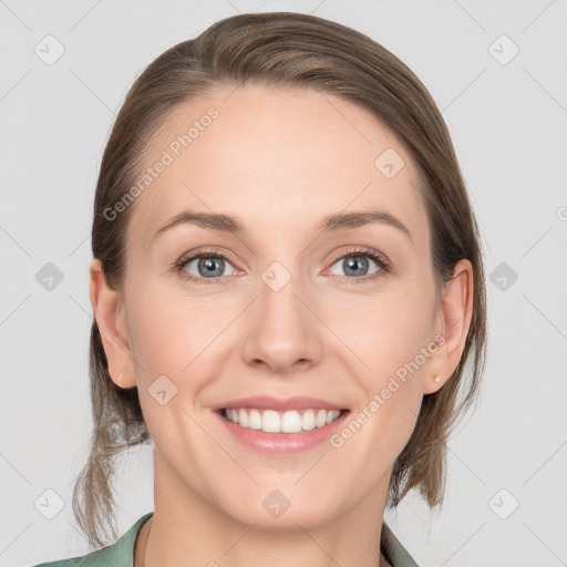 Joyful white young-adult female with medium  brown hair and grey eyes