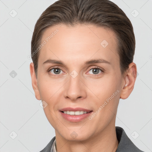 Joyful white adult female with short  brown hair and grey eyes