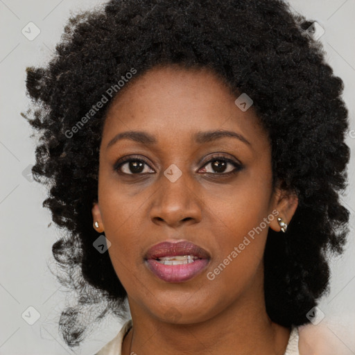 Joyful black young-adult female with medium  brown hair and brown eyes