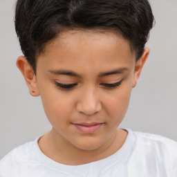 Joyful white child male with short  brown hair and brown eyes