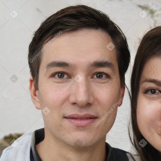 Joyful white young-adult male with short  brown hair and brown eyes