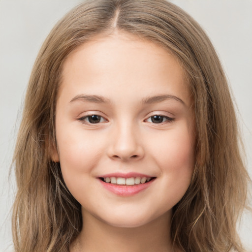 Joyful white child female with long  brown hair and brown eyes