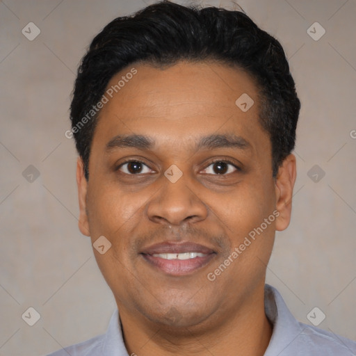 Joyful black young-adult male with short  black hair and brown eyes