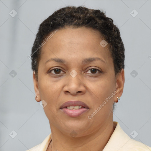 Joyful black adult female with short  brown hair and brown eyes