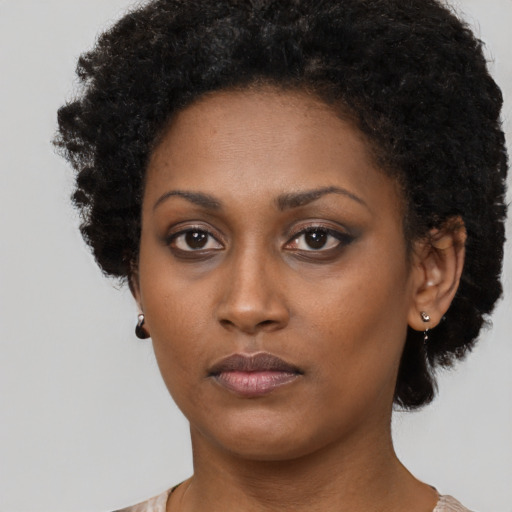 Neutral black young-adult female with short  black hair and brown eyes