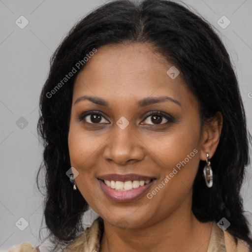 Joyful black young-adult female with long  brown hair and brown eyes