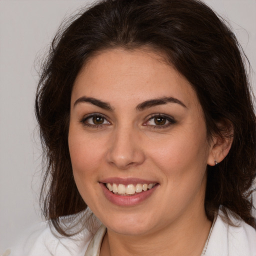 Joyful white young-adult female with medium  brown hair and brown eyes