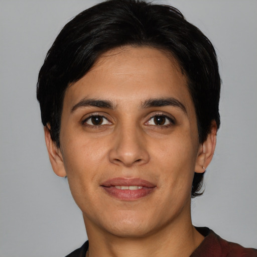 Joyful white young-adult female with short  black hair and brown eyes