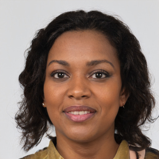 Joyful black young-adult female with medium  brown hair and brown eyes