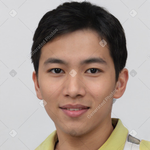 Joyful asian young-adult male with short  brown hair and brown eyes