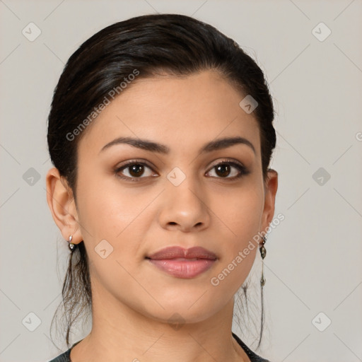 Joyful latino young-adult female with medium  brown hair and brown eyes