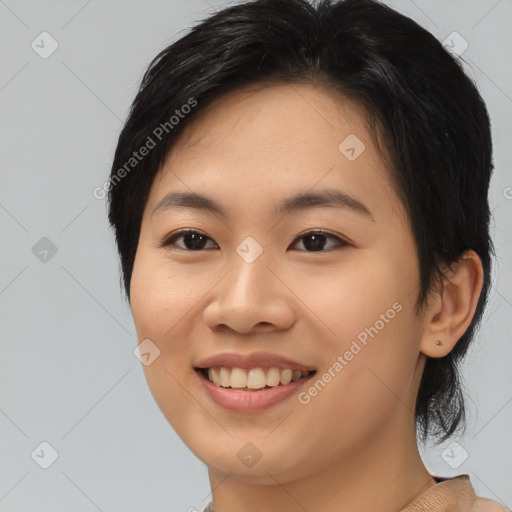 Joyful asian young-adult female with medium  black hair and brown eyes