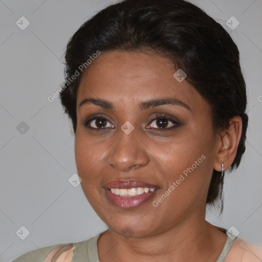 Joyful black young-adult female with medium  brown hair and brown eyes