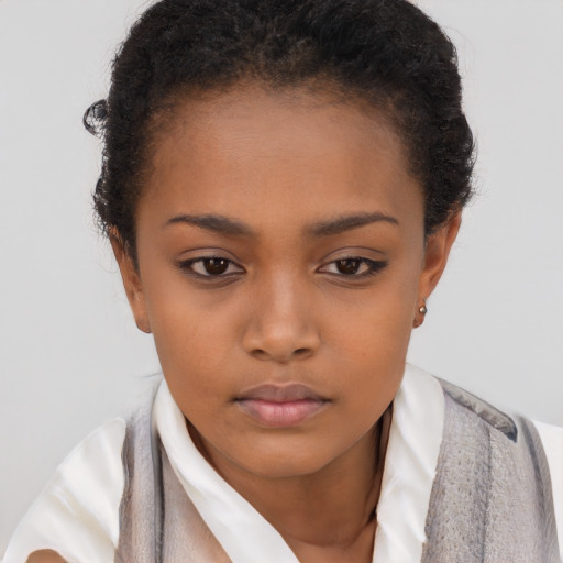Neutral black child female with short  brown hair and brown eyes