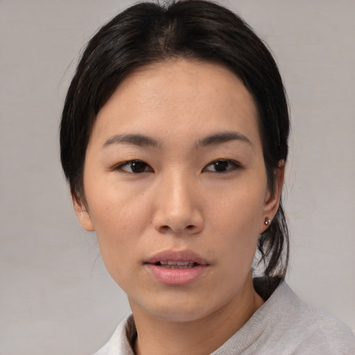 Neutral asian young-adult female with medium  black hair and brown eyes